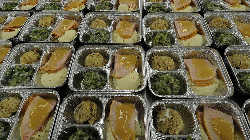 Miami Valley Meals prepares hundreds of Thankgiving meals Monday Nov. 21, 2022 for people in need. MARSHALL GORBY\STAFF
