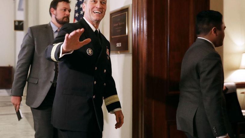 Physician to the president U.S. Navy Rear Admiral Ronny Jackson waves to journalists as he heads into a meeting with Senate Veterans Affairs Committee Chairman Johnny Isakson (R-GA) in the Russell Senate Office Building on Capitol Hill April 16, 2018 in Washington, DC.