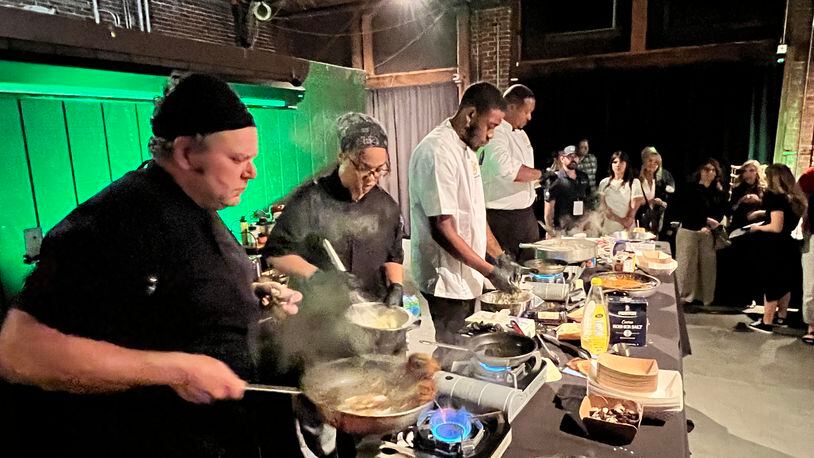 The final round of the Diced in Dayton Chef's Challenge saw the team from Corner Kitchen led by executive chef Gavin St. Denis (far left), face off agains the team from Rich Taste Catering led by chef and owner Gerald Richardson (far right). PHOTO BY ALEXIS LARSEN
