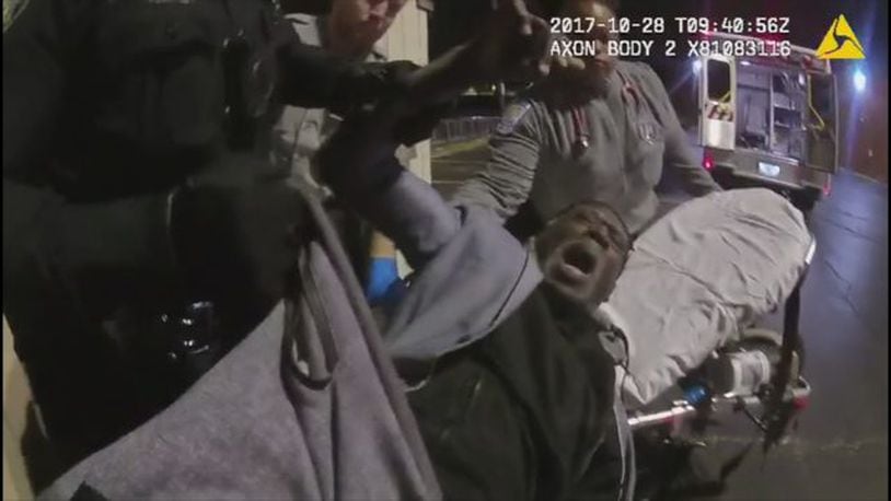 Recently obtained police bodycam video shows officers removing a disabled man from his car. (Photo: WSBTV.com)