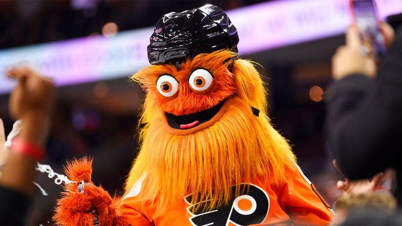 FILE – In this Monday, Jan. 13, 2020 file photo, the Philadelphia Flyers' mascot, Gritty, performs during an NHL hockey game in Philadelphia. Philadelphia police said Gritty has been cleared of allegations that he assaulted a 13-year-old boy during a photo shoot in November of 2019.