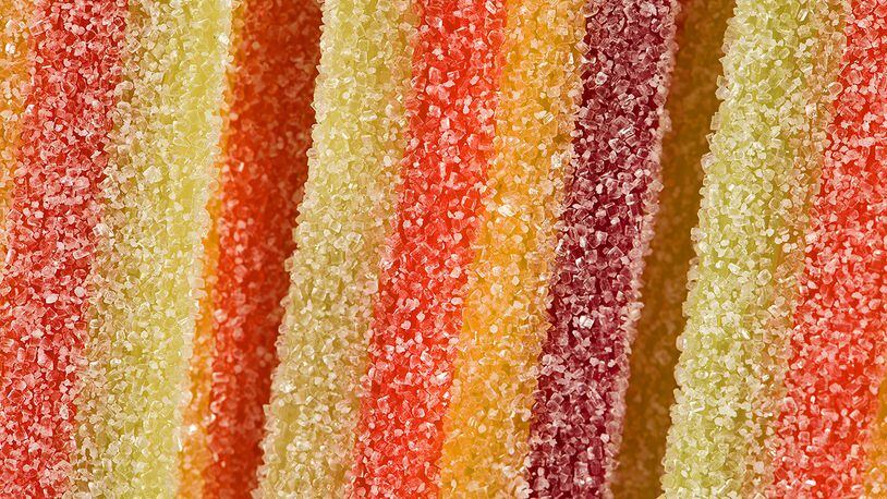 Research from a U.K. medical school says having a sweet tooth may be linked with lower body fat. (Photo illustration by Dan Kitwood/Getty Images)