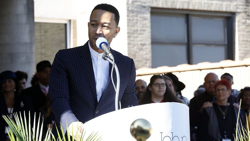 John Legend speaks to the crowd before the ribbon cutting for the John Legend Theater Sunday. Bill Lackey/Staff