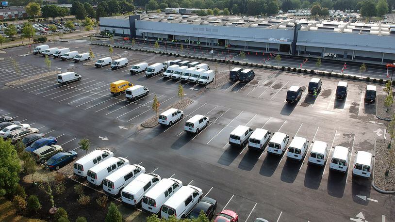 Amazon is ramping up its operation in the Kettering Business Park. Delivery vans have been filling the parking lots of the distribution center for about three weeks. TY GREENLEES / STAFF