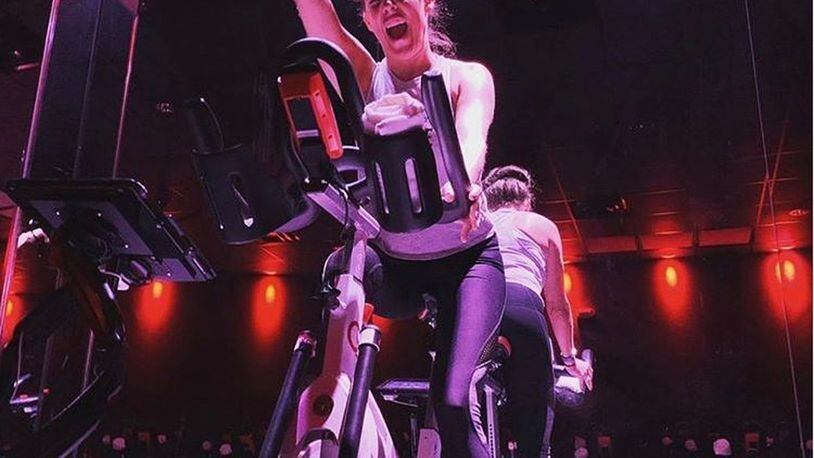 Julie Given at CycleBar at Austin Landing. While Cycle Bar was closed, many of the bikes from the indoor cycling studio were still getting use as they were rented out to members who could pedal along during Livestream classes. CONTRIBUTED