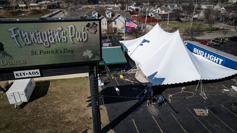 Flanagan’s Pub gears-up for St. Patrick’s Day setting up their large tent in the parking lot. Jim Noelker/Staff