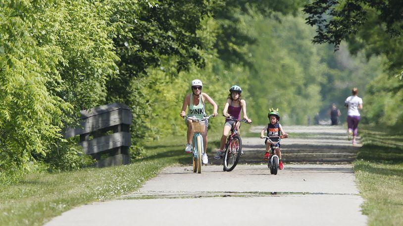 The Creekside Trail in Beavercreek that runs from Eastwood MetroPark to Xenia is approximately 18 miles. (source: TY GREENLEES / STAFF)