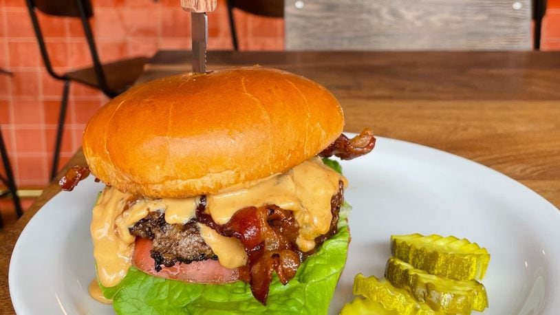 Rusk Kitchen + Bar's "The King" burger is 1/3 pound smashburger, peanut butter, bacon, sweet onion jam, lettuce and tomato. Rusk is located at 2724 Woodburn Avw. in Walnut Hills, Cincinnati. CONTRIBUTED/CINCINNATI BURGER WEEK
