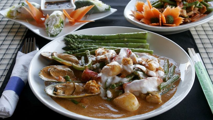 Siam Pad Thai's Panang Curry with Seafood, (clockwise from front)  the Soft Roll, and Chicken Spicy Green Bean. 2009 file photo by Jan Underwood