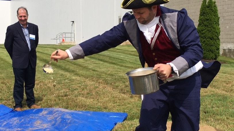 A White Castle "town crier" "christens" ground about to be broken for construction with grilled onions. The White Castle food plant in Vandalia will double in size. THOMAS GNAU/STAFF