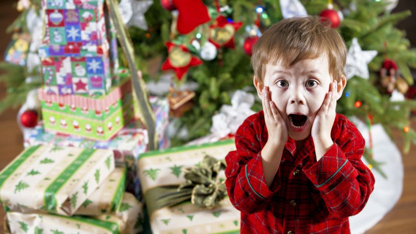 Child reacts to Christmas presents.