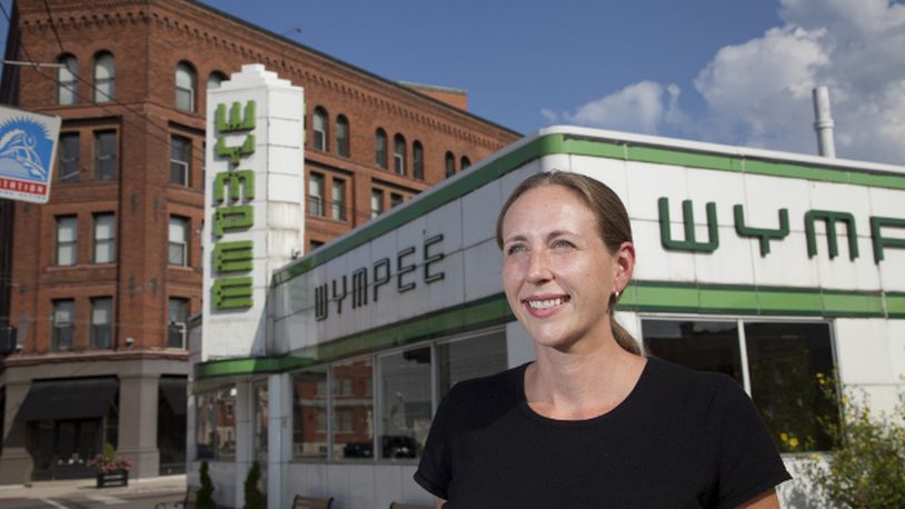 Kimberly Collett in front of her restaurant in 2013. FILE PHOTO