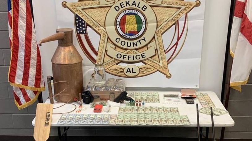Authorities in northeast Alabama confiscated meth, a moonshine still, weapons and cash.