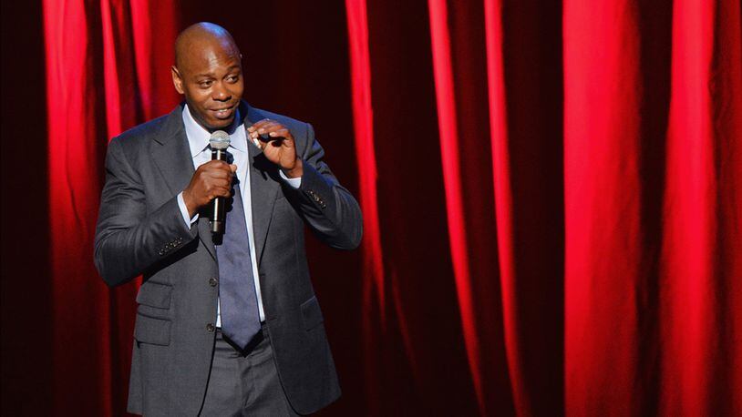 Comedian/actor Dave Chappelle performs at Radio City Music Hall on June 19, 2014 in New York City. Netflix announced Chappelle is bringing three comedy specials to the platform.