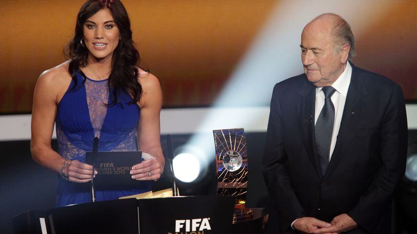 Hope Solo and Sepp Blatter announce Abby Wambach as FIFA women's player of the year during the Ballon d'Or Gala in 2013.