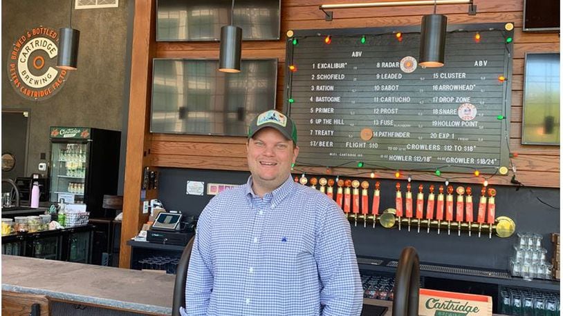 Kyle Hackbarth, chief operating officer and co-founder of Cartridge Brewing, and his team are ready to serve guests with 20 locally brewed beers on tap at the full-service brewpub. ED RICHTER/STAFF