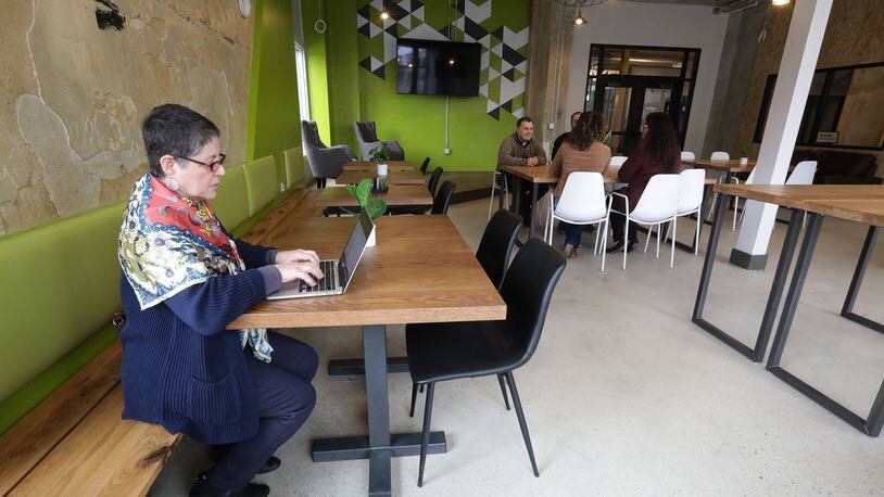 Patrice Watson was taking advantage of the shared working space that opened the first time at the COhatch in Springfield Monday. BILL LACKEY/STAFF