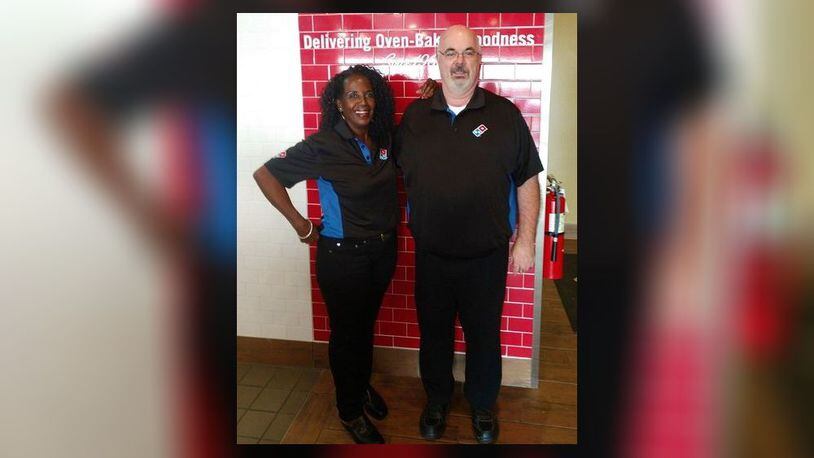 T.J. Taylor, new owner of three Domino's locations, pictured with his wife, Andrea.