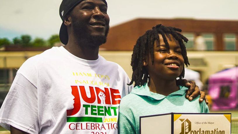 DeMauntezz Oatis and Deion Oatis receive a proclamation after going to Hamilton City Council in 2020, where Juneteenth was declared a holiday in the City of Hamilton. DeMauntezz is Deion's father. CONTRIBUTED