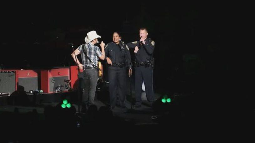 Boon Police Officers Kim Tavares and Stephen McNulty performed "God Bless America" at Brad Paisley's concert. (Photo: Boston25News.com)
