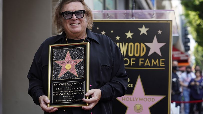 "American Pie" singer/songwriter Don McLean poses with a replica of his new star on the Hollywood Walk of Fame during a ceremony for him, Monday, Aug. 16, 2021, in Los Angeles. (AP Photo/Chris Pizzello)