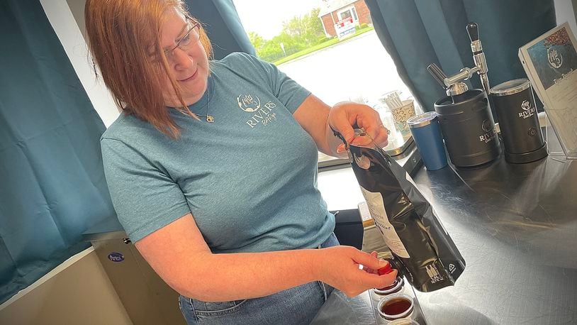Fifty5 Rivers Cold Brew is located at 644 N. Broad St. in Fairborn. Pictured is owner Lynne Mowery pouring cold brew samples. NATALIE JONES/STAFF