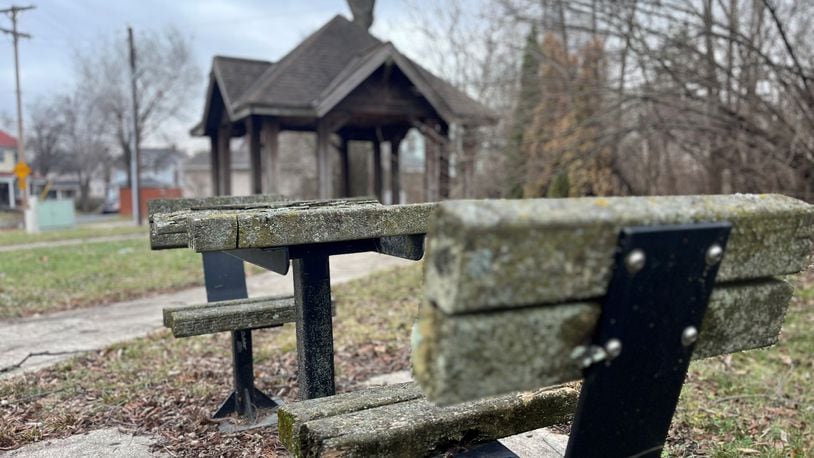 An underutilized park with rotting wooden tables and seating at 300 Delaware Ave. in the Five Oaks neighborhood in northwest Dayton. CORNELIUS FROLIK / STAFF