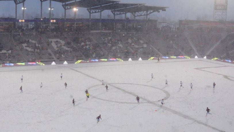 Members of the Colorado Rapids and Portland Timbers braves chilling weather and a snowstorm during Saturday night's match.