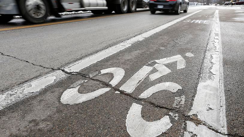Plans to make biking safer in Yellow Springs may include dedicating a portion of roadways to bicyclists, similar to this bike lane in Springfield. Bill Lackey/Staff