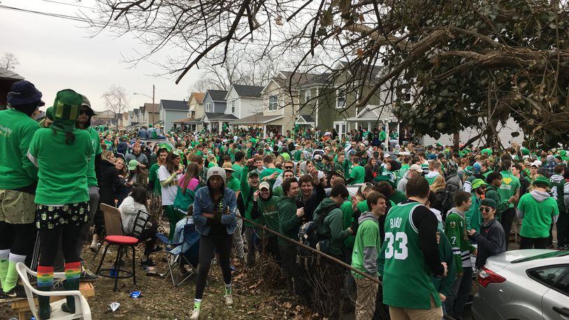 FILE: Police in riot gear dispersed a large crowd that gathered on Lowes Street in Dayton during St. Patrick’s Day celebrations Saturday March 17, 2018. Steve Maguire/Staff