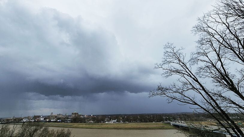 Dark clouds could be seen in Hamilton while Butler County was under a severe thunderstorm warning Wednesday afternoon, March 23, 2022, for a line of strong storms that moved through the region. NICK GRAHAM / STAFF