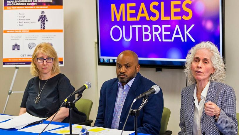 Los Angeles County Department of Public Health experts, from left, Dr. Sharon Balter, Director of Acute Communicable Disease Control, Muntu Davis, Health Officer, and Dr. Barbara Ferrer, Director, answer questions regarding the measles response and the quarantine orders in Los Angeles Friday, April 26, 2019. More than 900 students and staff members at two Los Angeles universities have been quarantined on campus or sent home in one of the most sweeping efforts to contain the spread of measles in the U.S. (AP Photo/Damian Dovarganes)