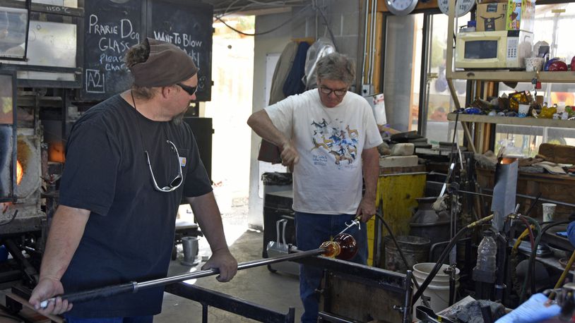 Collaborating on a glass project are (left to right) Robert “Spooner” Marcus and Patrick Morrissey at Prairie Dog Glass, Santa Fe, New Mexico, 2019. CONTRIBUTED: CATHY SHORT/LIZARD LIGHT PRODUCTIONS