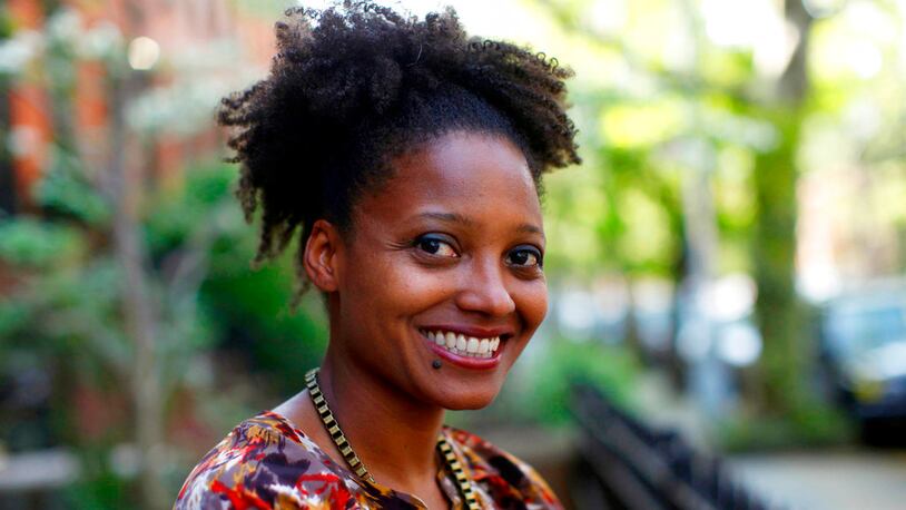 FILE - In this April 16, 2012 file photo, Pulitzer Prize winning poet Tracy K. Smith poses outside her apartment in New York. Smith is the country's new poet laureate. On Wednesday, the Library of Congress announced Smith's appointment to a one-year term. (AP Photo/Jason DeCrow, File)