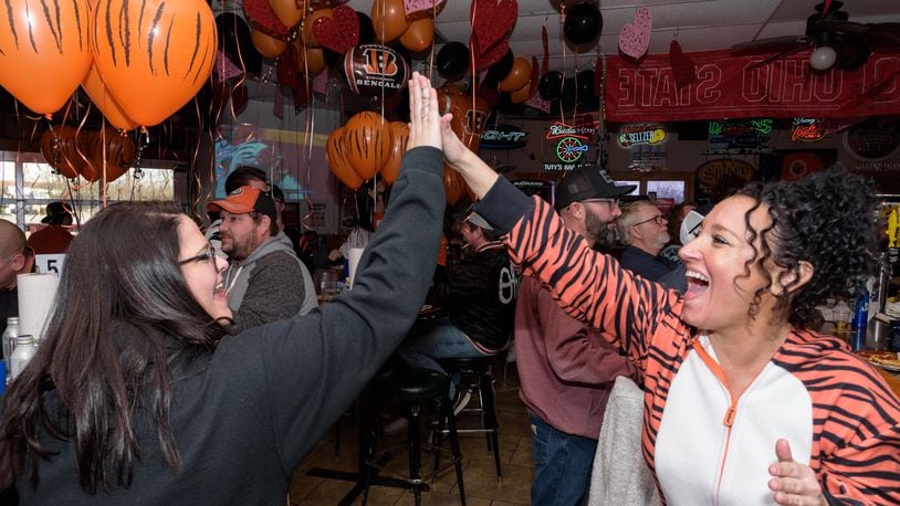 Who Dey! Dayton area fans cheered on the Cincinnati Bengals to victory in the AFC Championship game over the Kansas City Chiefs in overtime with a score of 27-24 on Sunday, Jan. 30, 2022. The Bengals will face the Los Angeles Rams in Super Bowl LVI on Sunday, Feb. 13, 2022. Even though Tuty’s Bar & Grill in Beavercreek is a Browns Backers bar, they gave Bengals fans a warm welcome to watch the game complete with Bengals decorations. Did we spot you there? TOM GILLIAM / CONTRIBUTING PHOTOGRAPHER