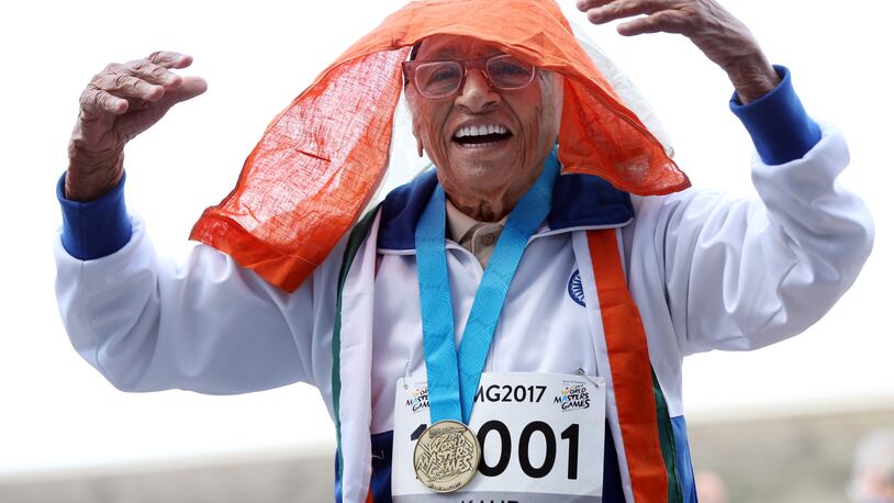 101-year-old Man Kaur from India celebrates after competing in the 100m sprint in the 100+ age category at the World Masters Games at Trusts Arena in Auckland on April 24, 2017. / AFP PHOTO / MICHAEL BRADLEYMICHAEL BRADLEY/AFP/Getty Images ORIG FILE ID: AFP_NT078