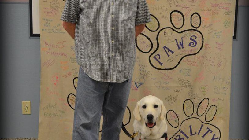 Xenia Veteran James Given, U. S. Coast Guard (Retired) and his service dog Rundle