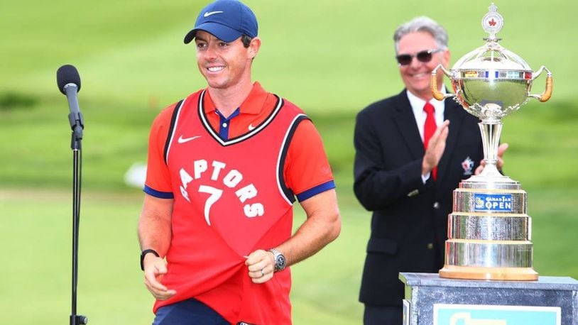Rory McIlroy celebrated his victory in the Canadian Open by wearing a Toronto Raptors jersey during the trophy presentation.