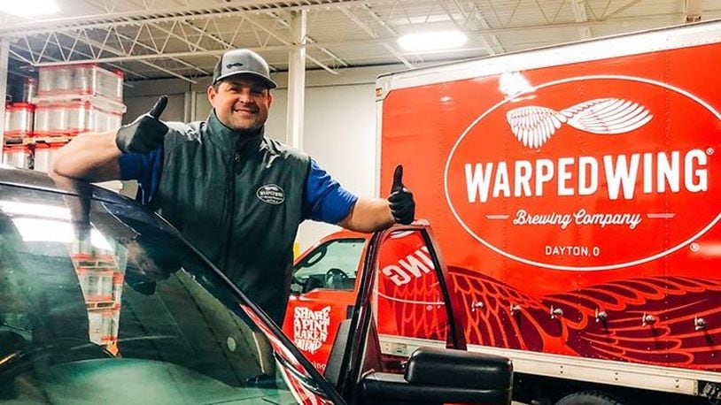 Nick Bowman, co-founder of Warped Wing Brewing Company, has been delivering beer to customers' homes, using contact-less delivery. The downtown Dayton brewery is also offering its food menu for curbside pickup and delivery.
