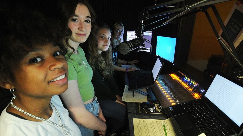 Centerville High School students, left to right, Aki'Lah McKee, Samantha Luckett, Evelyn Kemp and Faith Dunn working at the school's radio station Thursday Sept. 22, 2022. MARSHALL GORBY\STAFF