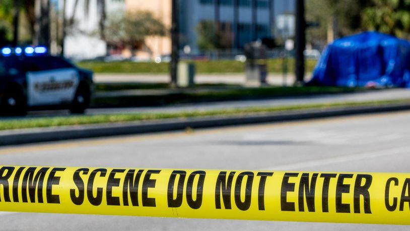 Police tape is stretched outside of Marjory Stoneman Douglas High School at the corner of Holmberg Road and Coral Springs Drive in Parkland.