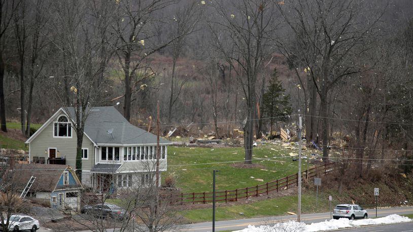 The debris from an explosion is seen behind the parking lot of a high school in Hardyston, New Jersey.