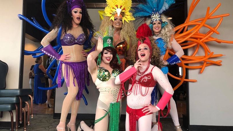 Dayton's famous drag troupe The Rubi Girls helped build some excitement for Masquerage 2018 with a performance at the theme reveal party on Aug. 24. The theme? Rio Nights. AMELIA ROBINSON/STAFF