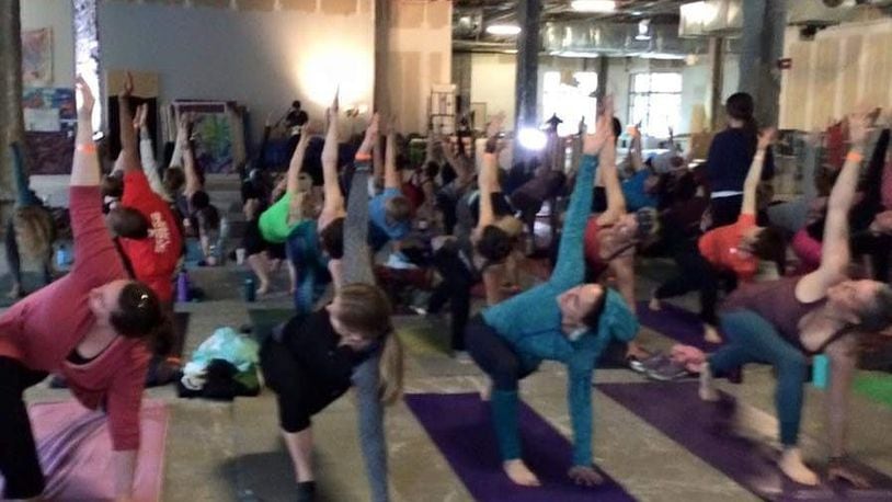 In its fourth year, the Urban Yoga Movement has been held in various downtown Dayton locations and will be held at the newly renovated Brightside Music & Event Venue on Jan. 5. CONTRIBUTED
