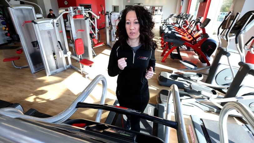 Alicia Colson, manager of Snap Fitness, in the new downtown Dayton location. The 24-hour gym, located at 312 N. Patterson Blvd., is one of the new gyms opening downtown. LISA POWELL / STAFF