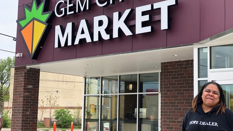 Kenya Baker,  Gem City Market community engagement director, stands outside the marker on Wednesday, April 28, 2021. After years of planning and work, the Gem City Market is announcing its grand opening. STAFF / CORY FROLIK