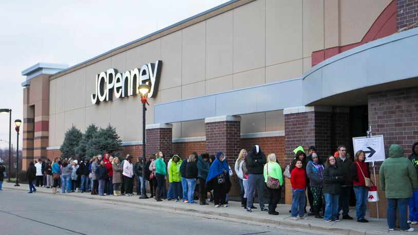Holiday shoppers wait in line on Thanksgiving Day for early deals at JCPenney at the Bridgewater Falls shopping center.