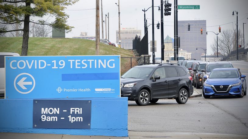 Cars waiting in line for COVID testing at the old Montgomery County fairgrounds stretched down North Main Street to the ER entrance of Miami Valley Hospital Monday Dec. 27, 2021.