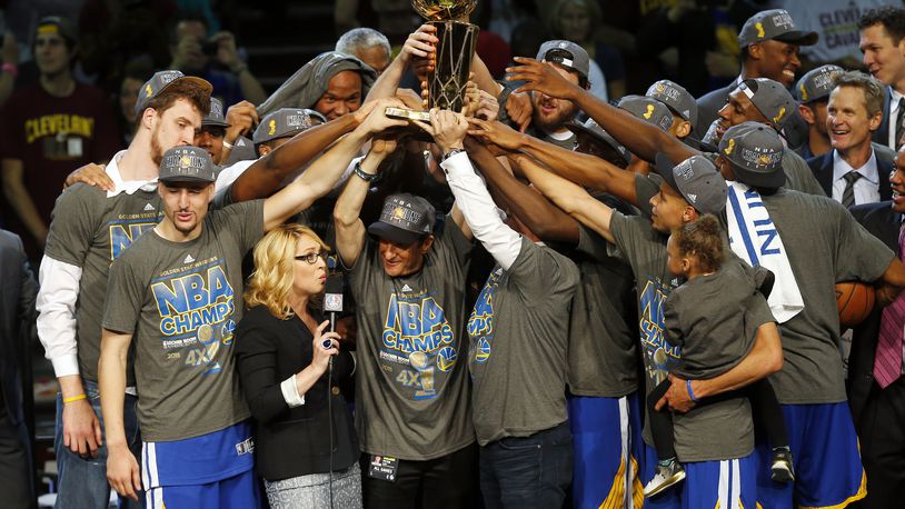 The members of the Golden State Warriors celebrate after winning the NBA Finals against the Cleveland Cavaliers in Cleveland on June 17, 2015. The Warriors defeated the Cavaliers 105-97 to win the best-of-seven game series 4-2.