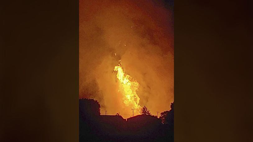 In this Thursday, Aug. 1, 2019 photo provided by Naomi Hayes, a fire burns after an explosion near Junction City, Kentucky.